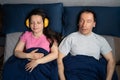 Snoring Husband Man And Partner Woman With Headphones Royalty Free Stock Photo