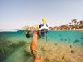 Snorkel swim in shallow water with coral fish, Red Sea, Egypt Royalty Free Stock Photo