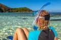 Snorkeler relaxing on tropical beach Royalty Free Stock Photo