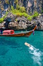 Snorkeling on the background of the boat Thai longtail boat