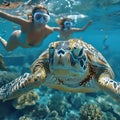 Snorkeling couple with a green sea turtle