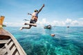 Snorkeling divers jump in the water