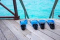 Snorkeling fins on sea deck Royalty Free Stock Photo