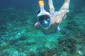 Snorkeling girl in swimsuit. Snorkel in coral reef of tropical sea. Full-face snorkeling mask. Underwater photo Royalty Free Stock Photo