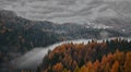The snow arrives on the mountains to cover the autumn colors Royalty Free Stock Photo