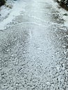 Snow on asphalt on a small german road Royalty Free Stock Photo