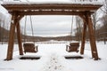 Snow on the back of an old swing Royalty Free Stock Photo