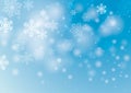 Blue snow background with blur and snowflakes Royalty Free Stock Photo