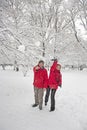 Young couple throwing snowballs