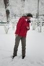 Young man dodging a snowball 