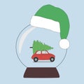 A snow ball in a New Year`s cap. the car is carrying a Christmas tree for the holiday. The concept of New Year and Christmas holid