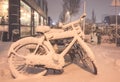 Snow on bikes in front of a house