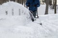 Snow blower in action clearing a residential driveway after snow storm Royalty Free Stock Photo