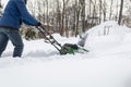 Snow blower in action clearing a residential driveway after snow storm Royalty Free Stock Photo