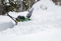 Snow blower in action clearing a residential driveway after snow storm Royalty Free Stock Photo