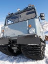 Snow bus mobile and chapel on italian Dolomites mountains - snowy winter day