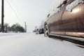 Snow calamity. Snowy country road and parked cars. Winter.