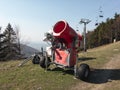 Snow cannon and gun for making artificial snow is abandoned during hot and warm wetaher in the spring and autumn / fall