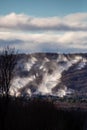 Snow cannons making snow on Granite Peak Ski Hill in Rib Mountain, Wausau, Wisconsin just before they open Royalty Free Stock Photo