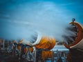 Snow cannons spray artificial snow crystals. Cars make snow. Artificial snow system Royalty Free Stock Photo