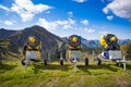 Snow cannons waiting for the winter action in the European alps at the valley Kleinwalsertal