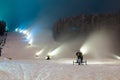 Snow cannons working at night in the mountains Royalty Free Stock Photo