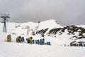 Snow canon at ski resort with mountains on background