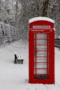 Snow capped English telephone box, University of Cambridge, England, UK Royalty Free Stock Photo