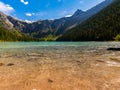 Snow Capped Heavens Peak Above The Clear Water of Avalanche Lake Royalty Free Stock Photo