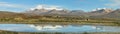 Snow capped high mountains reflected in Lake Chungara Royalty Free Stock Photo