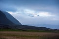 Snow capped mountain and clouds in Iceland