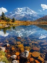 A snow-capped mountain reflected in a crystal-clear lake Royalty Free Stock Photo