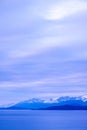 Snow capped mountains and coastal Alaska under pastel sunset Royalty Free Stock Photo