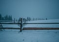 Snow-capped mountains in corpses, snow falls on trees, small village Royalty Free Stock Photo