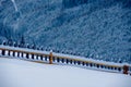 Snow-capped mountains in corpses, snow falls on trees, small village Royalty Free Stock Photo