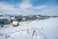 Snow-capped mountains in corpses, snow falls on trees, small village Royalty Free Stock Photo