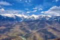 Snow-capped mountains, extreme sports. Cloudy sky.