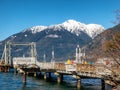 Snow capped mountains provide backdrop to wharf structure