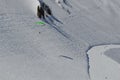 Snow-capped mountains, snowdrifts, blue sky in the Caucasian ski resort.Hang glider flies in a mountain gorge.