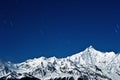 Snow-capped mountains the stars Royalty Free Stock Photo