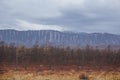 Snow capped mountains and taiga Royalty Free Stock Photo