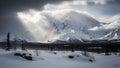 Snow- Capped Mountains Under Dramatic Sunbeams Breaking Through Stormy Clouds Keywords: mountains, snow, winter Royalty Free Stock Photo