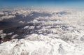 Snow-capped mountains. View of jet