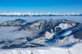 Snow Capped Peaks and Fog in the Valleys. Aerial View Royalty Free Stock Photo
