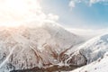 Snow-capped peaks of the Sunny Caucasus Mountains. Caucasian landscape Royalty Free Stock Photo