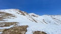 Snow-capped spring mountains. Beautiful mountain landscape. The amazing nature of Kyrgyzstan. Blue sky Royalty Free Stock Photo