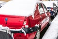 Snow on cars in the morning. Winter season  icy cars. Winter concept  frozen cars on the road in Bucharest  Romania  2021 Royalty Free Stock Photo