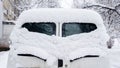 Snow on cars after snowfall. rear window, eye-like Royalty Free Stock Photo