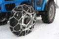 Snow chains tractor wheels Royalty Free Stock Photo