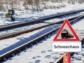 Snow chaos warning sign at the railway in German Royalty Free Stock Photo
